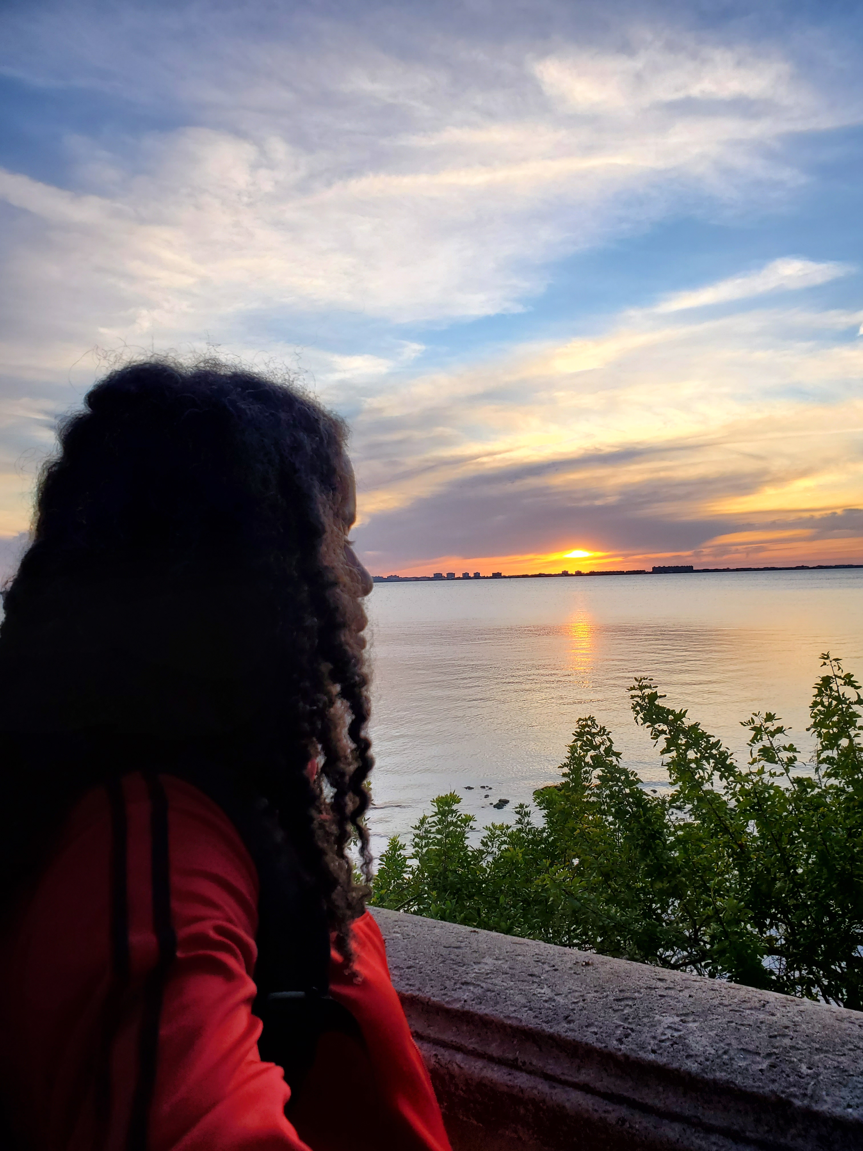 Image of Alyscia Cunningham with the sunset in the background.